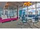 Bright lounge with modern seating, glass table and city skyline views through floor to ceiling windows at 845 Spring Nw St # 322, Atlanta, GA 30308