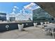 A rooftop patio with potted plants and lounge chairs and tables creates an ideal space to unwind at 845 Spring Nw St # 322, Atlanta, GA 30308