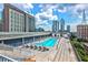 Beautiful rooftop pool with lounge chairs offering scenic views of the surrounding city skyline at 845 Spring Nw St # 322, Atlanta, GA 30308