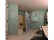 Bathroom with toilet, vanity, and shower/tub combo with leafy shower curtain at 3875 Wintergreen Ct, Marietta, GA 30062