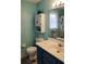 Bathroom featuring toilet, vanity with mirror, and cabinet at 3875 Wintergreen Ct, Marietta, GA 30062