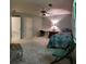 Well-lit bedroom showcasing a single bed, ample space, two closets, ceiling fan and a window with outside views at 3875 Wintergreen Ct, Marietta, GA 30062