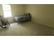 Comfortable bedroom features neutral walls, window for natural light, carpeted floors, and a single bed at 3875 Wintergreen Ct, Marietta, GA 30062