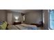 Spacious bedroom with bright windows, a queen bed, and a charming dresser for ample storage at 3875 Wintergreen Ct, Marietta, GA 30062