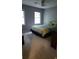 Bright bedroom with a comfortable bed and two windows at 3875 Wintergreen Ct, Marietta, GA 30062