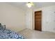 Bedroom features a bookshelf, two doors, and neutral-colored walls at 3875 Wintergreen Ct, Marietta, GA 30062
