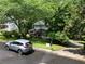 Inviting two-story home with green shutters, a long front porch, and a 'For Sale' sign on the lawn at 3875 Wintergreen Ct, Marietta, GA 30062