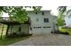 Two story traditional home featuring a two-car garage and outdoor deck at 3875 Wintergreen Ct, Marietta, GA 30062