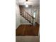 Foyer featuring hardwood floors, staircase, and neutral wall color at 3875 Wintergreen Ct, Marietta, GA 30062