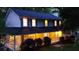 View of the front of the house at night, highlighting its inviting porch and well-lit windows at 3875 Wintergreen Ct, Marietta, GA 30062
