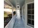 Long front porch with white railings, traditional lighting and several chairs for enjoying the view at 3875 Wintergreen Ct, Marietta, GA 30062