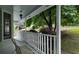Welcoming front porch with a scenic view of the well-maintained front yard and surrounding foliage at 3875 Wintergreen Ct, Marietta, GA 30062