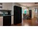 A stylish kitchen with stainless steel appliances, a dining area, and natural lighting from the adjacent windows at 3875 Wintergreen Ct, Marietta, GA 30062