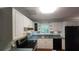 Functional kitchen with white cabinetry, stainless steel appliances, and ample counter space at 3875 Wintergreen Ct, Marietta, GA 30062