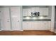 Well-designed kitchen with ample cabinet space, modern microwave, and beautiful wood floors at 3875 Wintergreen Ct, Marietta, GA 30062
