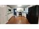 Traditional kitchen with white cabinetry and stainless steel appliances and hardwood floors at 3875 Wintergreen Ct, Marietta, GA 30062