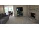 Open living area with fireplace and large TV, seamlessly connected to a dining space with seating for four at 3875 Wintergreen Ct, Marietta, GA 30062