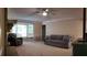 Comfortable living room features neutral tones, a bay window, crown molding, and ample natural light for a serene ambiance at 3875 Wintergreen Ct, Marietta, GA 30062