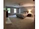 Spacious main bedroom featuring a fireplace, carpet floor, and two windows at 3875 Wintergreen Ct, Marietta, GA 30062