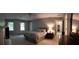 Large main bedroom featuring multiple windows, neutral paint, and a private ensuite entrance at 3875 Wintergreen Ct, Marietta, GA 30062