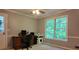 Bright home office with a large window offering peaceful views, neutral walls, and a ceiling fan at 3875 Wintergreen Ct, Marietta, GA 30062