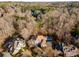 An aerial view showcases this property and neighborhood at 715 Newport Holw, Alpharetta, GA 30005