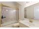 Bathroom offers a shower and tub combination and a single sink vanity with gold hardware at 715 Newport Holw, Alpharetta, GA 30005