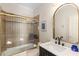 Traditional bathroom features tile shower and tub with a framed mirror over the vanity at 715 Newport Holw, Alpharetta, GA 30005
