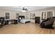 Spacious bedroom features a ceiling fan, three windows, a workspace, and a massage chair at 715 Newport Holw, Alpharetta, GA 30005