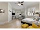 Spacious bedroom with hardwood floors, white built-ins, and a bay window with plantation shutters at 715 Newport Holw, Alpharetta, GA 30005