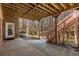 A covered patio leads out to the tree-lined back yard at 715 Newport Holw, Alpharetta, GA 30005