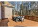 Spacious wooden deck, perfect for outdoor dining, overlooking a private wooded backyard at 715 Newport Holw, Alpharetta, GA 30005