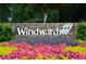 Community entrance sign surrounded by vibrant flower beds and lush landscaping at 715 Newport Holw, Alpharetta, GA 30005