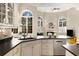 Kitchen featuring dark countertops, modern appliances and an eat-in breakfast nook with large arched windows at 715 Newport Holw, Alpharetta, GA 30005
