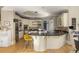 Stylish kitchen with granite countertops, stainless steel appliances, and custom cabinets for the discerning chef at 715 Newport Holw, Alpharetta, GA 30005