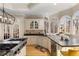Bright kitchen featuring granite counters, tile backsplash, stainless dishwasher and a window-filled breakfast nook at 715 Newport Holw, Alpharetta, GA 30005