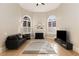 Inviting living room featuring a fireplace, large windows with shutters, and comfortable seating at 715 Newport Holw, Alpharetta, GA 30005