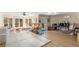 Bright playroom featuring natural light, a ceiling fan, and ample space for activities at 715 Newport Holw, Alpharetta, GA 30005