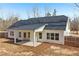 Charming home featuring a covered back patio and a spacious fenced yard at 814 Harmony Rd, Temple, GA 30179