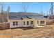 The back of the home features a covered patio and a large backyard, perfect for outdoor living at 814 Harmony Rd, Temple, GA 30179