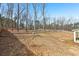 Large, level backyard with a wooden fence, perfect for outdoor activities and gardening at 814 Harmony Rd, Temple, GA 30179