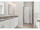 Stylish bathroom boasts double sinks with granite counters and a separate door for the shower and toilet at 814 Harmony Rd, Temple, GA 30179