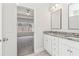 Bright bathroom with double sinks and granite counters that leads into a bedroom with a view at 814 Harmony Rd, Temple, GA 30179