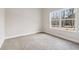 Well-lit bedroom with a large window overlooking the yard, providing a bright and airy space at 814 Harmony Rd, Temple, GA 30179