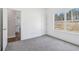 Neutral bedroom with carpet flooring, closet, and entry to the kitchen at 814 Harmony Rd, Temple, GA 30179