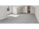 A well-lit bonus room with carpeted floors, windows, and wall trim ready to be an office, bedroom, or game room at 814 Harmony Rd, Temple, GA 30179