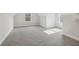 A well-lit bonus room with carpeted floors, windows, and wall trim ready to be an office, bedroom, or game room at 814 Harmony Rd, Temple, GA 30179