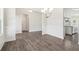 Dining area with wainscoting detail flowing into the kitchen with stainless steel appliances at 814 Harmony Rd, Temple, GA 30179