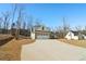 Wide driveway leading to a home with an attached two-car garage at 814 Harmony Rd, Temple, GA 30179