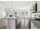 Modern kitchen boasts stainless appliances, granite countertops and open floor plan at 814 Harmony Rd, Temple, GA 30179